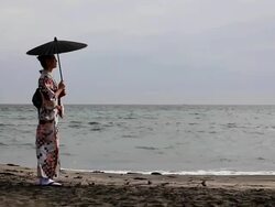 Japanese woman standing by the sea Stock Footage
