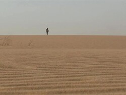 WS Man walking at the desert / Atar, ADRAR, Mauritania Stock Footage