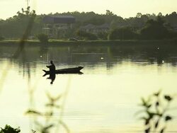 Fishermen at dawn long focus shot Stock Footage