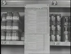 A woman shops in a local market using food rationing stamps. News Clip