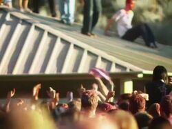crowd of people at a Hindu festival throwing a girl into the air Stock Footage
