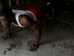 MS Young man doing push-ups inside  garage while working out / Minneapolis, Minnesota, United States Stock Footage