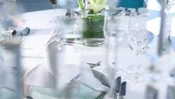 pouring white wine at fine dining table set up behind crystal curtain Stock Footage