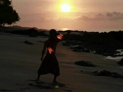 MS Sihouette of rasta man spinning fire on beach with sunrise / Montezuma, Punteranes, Costa Rica Stock Footage