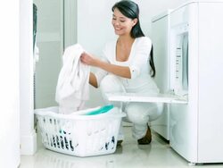 Woman doing the laundry Stock Footage
