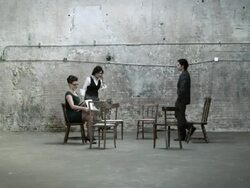Businesspeople walking in and sitting on chairs in warehouse Stock Footage