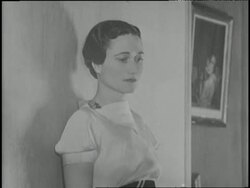 The Duchess of Windsor, Wallis Simpson, poses against a wall for a photograph. News Clip