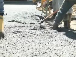 Concrete Workers Pouring and Troweling a New Driveway Stock Footage