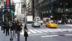 Traffic and pedestrians pass through an intersection near Grand Central Station in New York City. Stock Footage