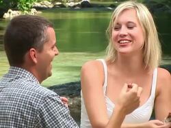 HD: Eating Chocolate By The River Stock Footage