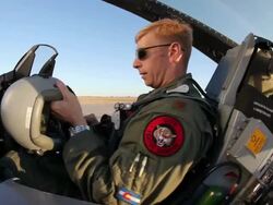 TS F-16 Pilot putting on his helmet in the cockpit, Aurora, Colorado, USA Stock Footage