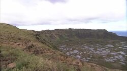 Puddles of water fill a crater bottom on Easter Island. Stock Footage