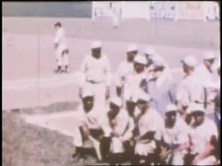 Black baseball players play in the Negro League. News Clip