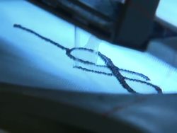 Industrial automatic sewing machine in action News Clip