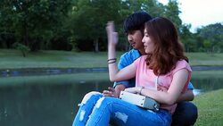 Asian couple talking to each other Stock Footage