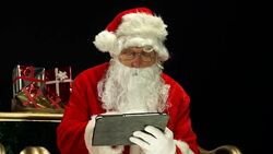 Santa / Father Christmas in sleigh on Digital Tablet Stock Footage