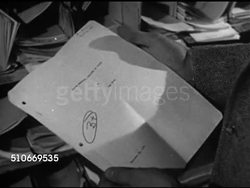 1951: HARVARD UNIVERSITY: DRAMATIZATION: Ws Male student walking into building, male student 'Ray' retrieving graded paper from shelf, MS B+ on cover page, 'Ray' handing paper to & meeting w/ professor in office (No SOT). Instructional Video