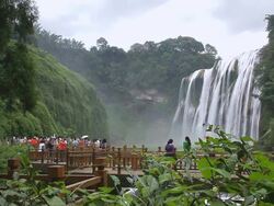 WS View of tourists enjoying view at Huangguoshu Falls (largest falls in Asia) / Anshun, guizhou, China Stock Footage