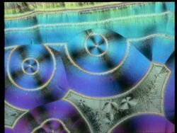 Rotate and zoom in to colourful crystals, concentric circle pattern Stock Footage