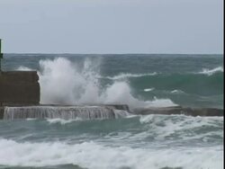 Waves breaking on harbour wall, Israel Stock Footage