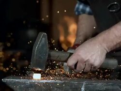HD Super Slow-Mo: Blacksmith At Work Stock Footage