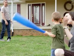 Young family play baseball Stock Footage