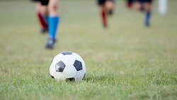 Kicking a Soccer Ball Stock Footage