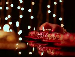 Young woman burning candles Stock Footage