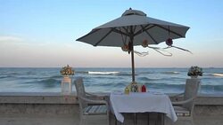 Dinner set on the beach Stock Footage