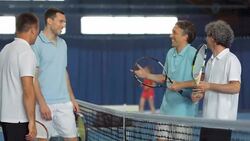 MS Men Talking After Playing Tennis Double Stock Footage
