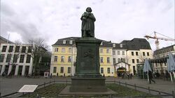 A statue dominates a plaza in Frankfurt, Germany. Stock Footage