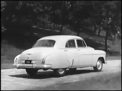 Montage: 1949 Chevrolet driving on cobblestone Stock Footage