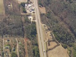 MS AERIAL Shot of traffic moving on road surrounded by trees in Nantahala National Forest / North Carolina, United States Stock Footage