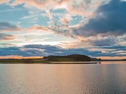 HD Motion Time-Lapse: Clouds Over A Lake Stock Footage