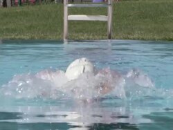 CU SLO MO Shot of Woman in swim cap swimming breast stroke / Davis, California, United States  Stock Footage