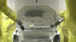 Robots spray a newly manufactured auto body. Stock Footage