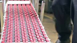 Man working at printers packing catalogs Stock Footage