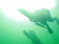 MS Shot of Special operation forces combat diver with DVP diver propulsion vehicle during underwater operation at ocean surface / Open water Stock Footage