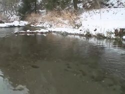 HD CRANE: Winterlandschaft mit Bachlauf und BÃ¤umen Stock Footage