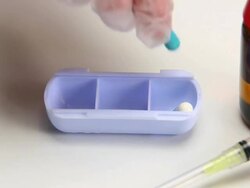 HD Placing pills in box close-up Stock Footage