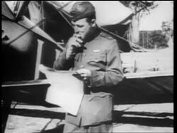 B/W 1910s Captain Elliot Spring (sp?) in uniform smoking cigarette + looking at paper outdoors / doc Stock Footage