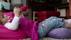 Baby Girl playing on cell phone Stock Footage