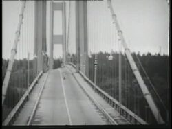 The Tacoma Narrows Bridge twists and buckles in high winds. Stock Footage