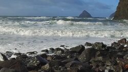 Slow motion of waves crashing on rocks at the beach Stock Footage