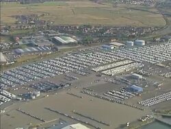 Aerial View, hundreds of new cars in port. NTSC, PAL Stock Footage