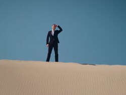 Businessman in desert Stock Footage