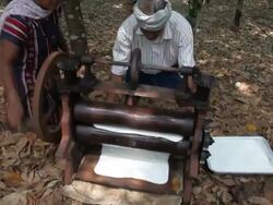 Raw rubber is pressed with a press. Stock Footage