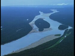 Aerial Amazon River meandering through rainforest, South America Stock Footage