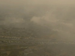 WS AERIAL View of traffic in polluted and smoking area / Lagos, Nigeria  Stock Footage
