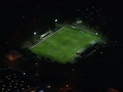 WS AERIAL View over teams playing football on ground in Saint Raphael at night / Provence Alpes Cote d'Azur, France Stock Footage